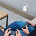 TP-Link RE205 range extender plugged into a wall outlet